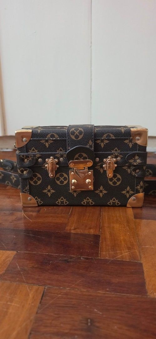Designer Inspired Trunk Handbag with Strap (Category: Luxury Bags & Wallets) located in Caloocan City. Submitted by echoes_of_nnah (Listing ID 1461010889, Image 2). Description: - Cute mini trunk style handbag - Classic monogram print - Detachable strap included - Elegant gold hardware details - Ideal for evening events or as a statement piece Jimin purchase.