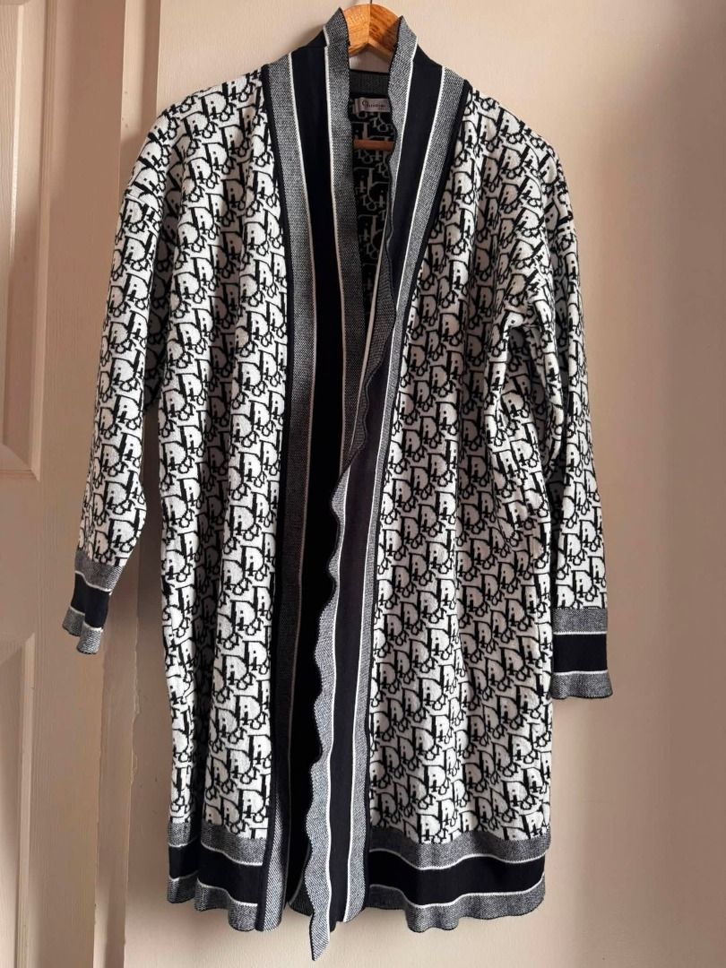 Dior All-Over Logo Knit Cardigan (Category: Luxury Apparel) located in Cebu City. Submitted by classy82 (Listing ID 1460922450, Image 1). Description: - Classic Dior monogram cardigan - Black and white knit - Long sleeves with ribbed cuffs - Open front with contrasting trim - Versatile layering piece - Chic and stylish.