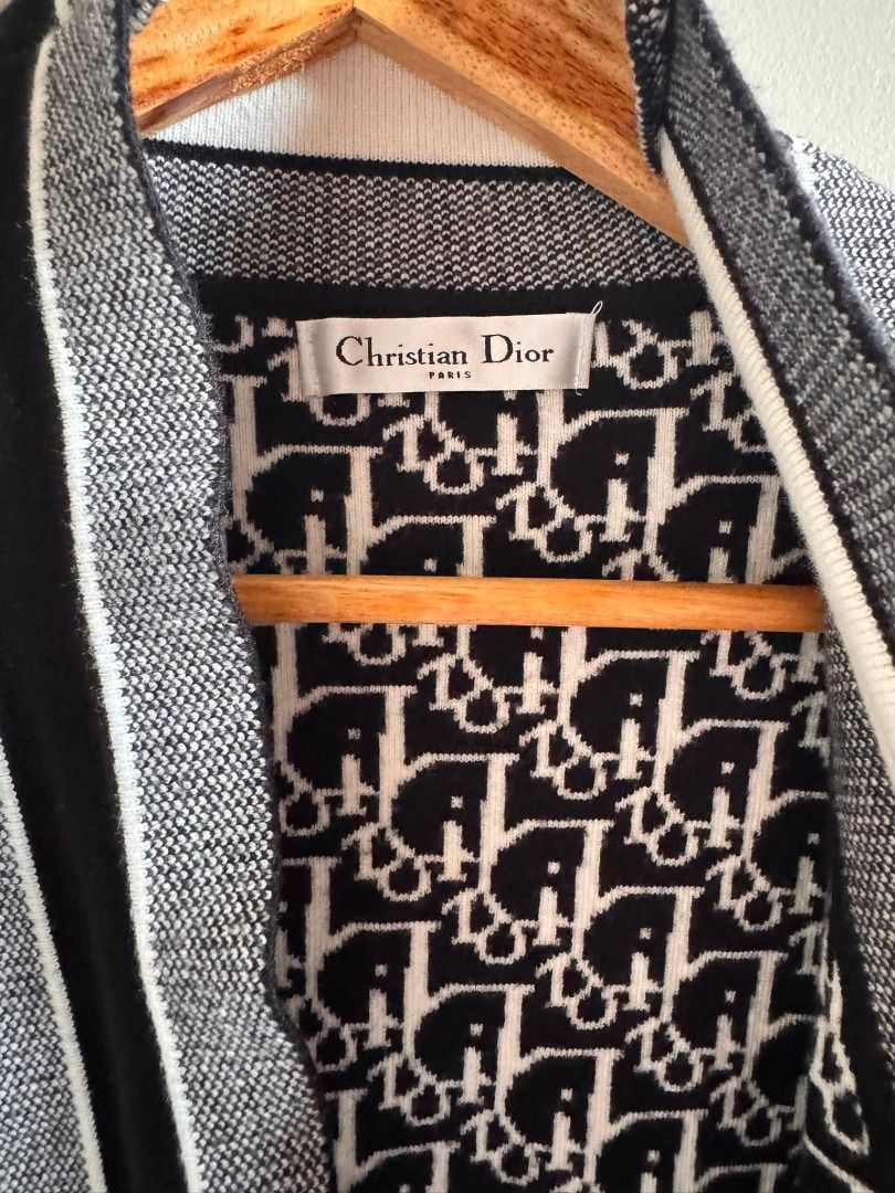 Dior All-Over Logo Knit Cardigan (Category: Luxury Apparel) located in Cebu City. Submitted by classy82 (Listing ID 1460922450, Image 2). Description: - Classic Dior monogram cardigan - Black and white knit - Long sleeves with ribbed cuffs - Open front with contrasting trim - Versatile layering piece - Chic and stylish.