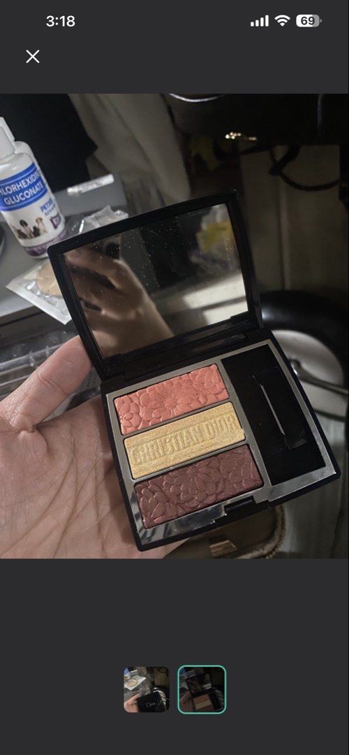 Dior Eyeshadow Palette (Category: Makeup) located in Manila. Submitted by declutterwithpeanut (Listing ID 1461107737, Image 2). Description: - Authentic Dior eyeshadow palette - Features three versatile shades - Comes with a convenient applicator - Sleek black compact case with an integrated mirror - Ideal for on-the-go touch-ups or everyday looks.