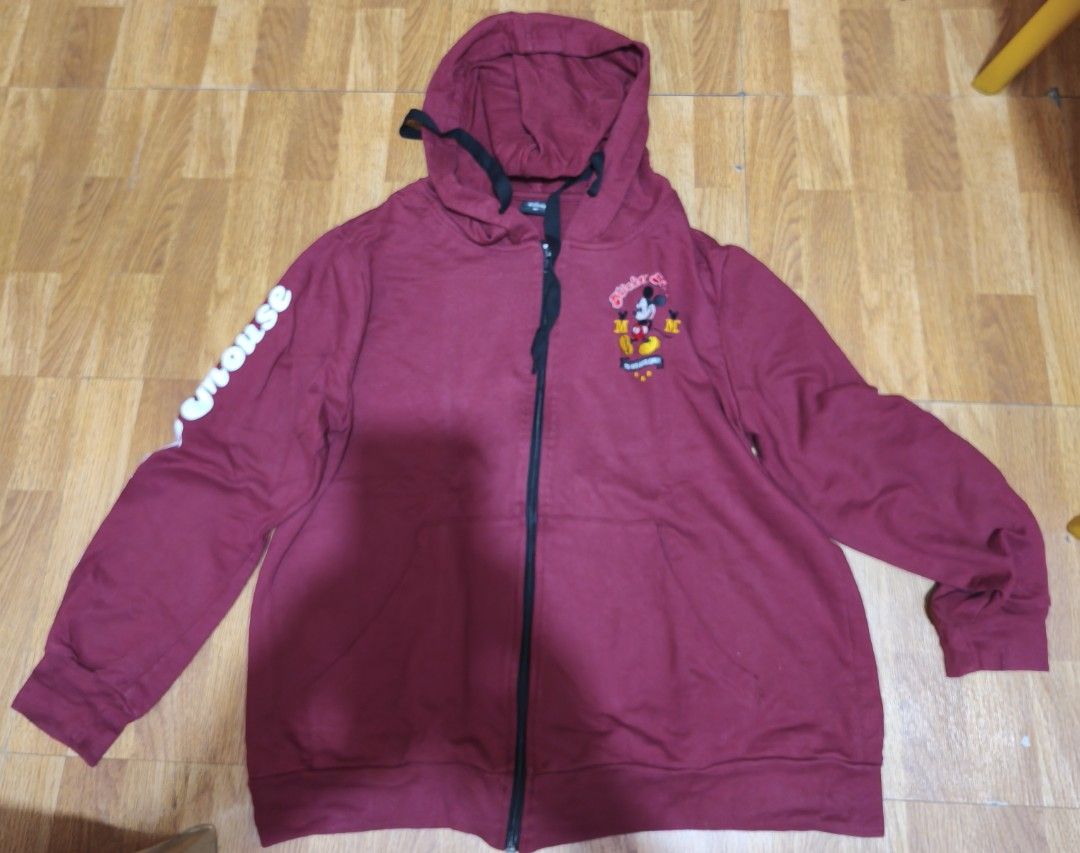 Disney Mickey Mouse Zip-Up Hoodie (Category: Hoodies) located in Quezon City. Submitted by acxsty (Listing ID 1461009749, Image 1). Description: - Maroon zip-up hoodie - Features a fun Mickey Mouse graphic on the front - 'Mickey Mouse' text detail on the sleeve - Adjustable drawstring hood - Two convenient front pockets - Ideal for everyday casual wear.