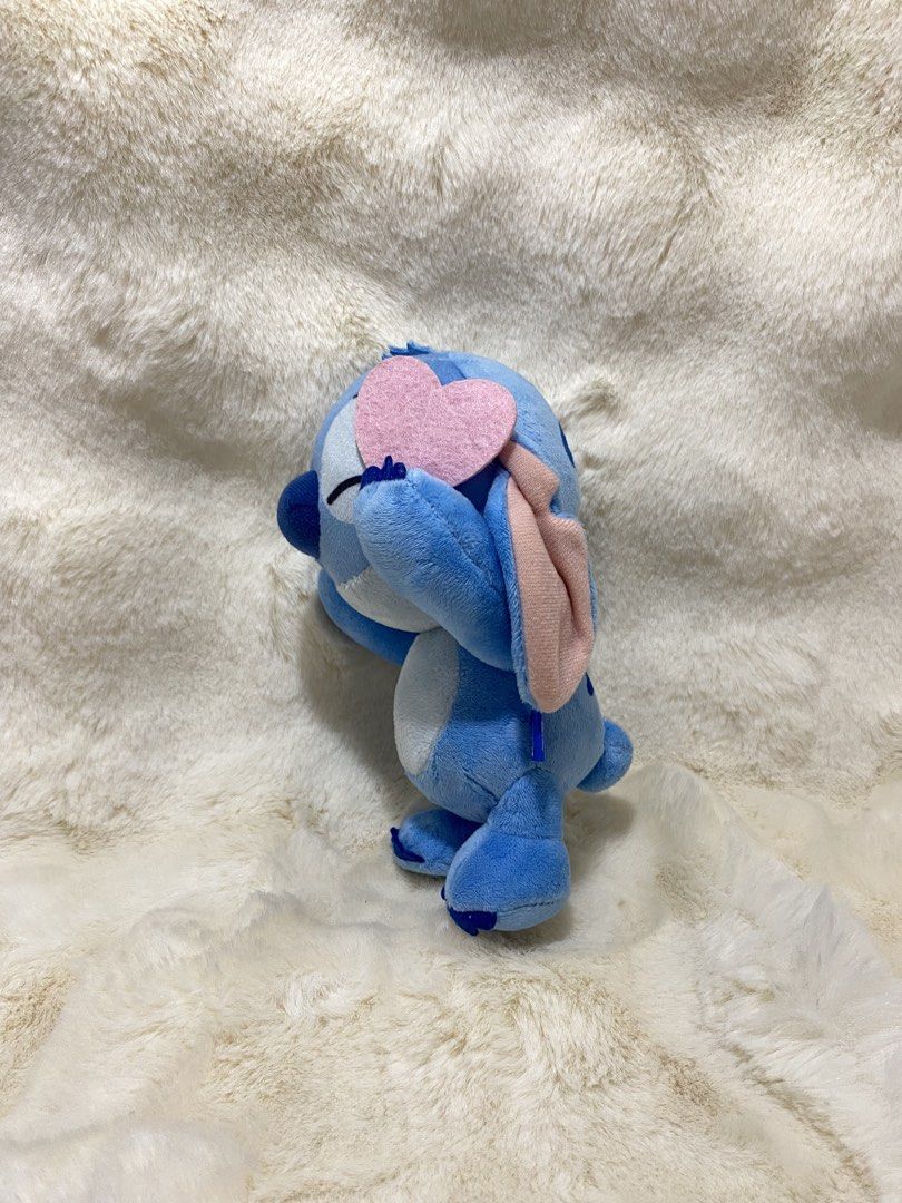 Disney Stitch Plush Toy with Pink Heart (Category: Plushies & Soft Toys) located in Kalibo. Submitted by ollie_stuffshop (Listing ID 1460984521, Image 2). Description: Before you send your inquiries: ❗️Last Price is already posted ❗️Manage your expectations, WYSIWYG ❗️May need washing ❗️Dropoff is every Wednesday & Sunday - Adorable blue Stitch plush toy - Features pink accents and a pink heart over its eye - Soft and huggable material - Ideal fo