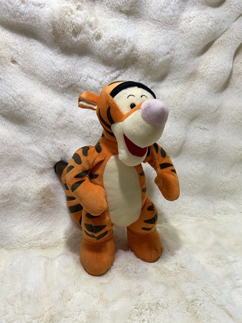 Disney Tigger Plush Toy (Category: Plushies & Soft Toys) located in Kalibo. Submitted by ollie_stuffshop (Listing ID 1460951173, Image 1). Description: 33cm x 17.5cm Before you send your inquiries: ❗️Last Price is already posted ❗️Manage your expectations, WYSIWYG ❗️May need washing ❗️Dropoff is every Wednesday & Sunday - Classic Tigger plush toy - Features iconic orange and black stripes - Stands upright on its own - Ideal for any Winnie the Poo