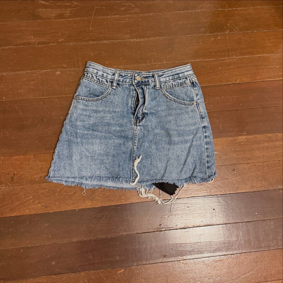 Distressed Denim Mini Skirt (Category: Skirts) located in Angeles City. Submitted by lesmiz24601 (Listing ID 1460976645, Image 1). Description: - Cute blue denim mini skirt - Features a raw hem with distressing - Ideal for casual summer outfits - Easy to style with tops and sneakers - 26-28” - A trendy addition to your wardrobe.