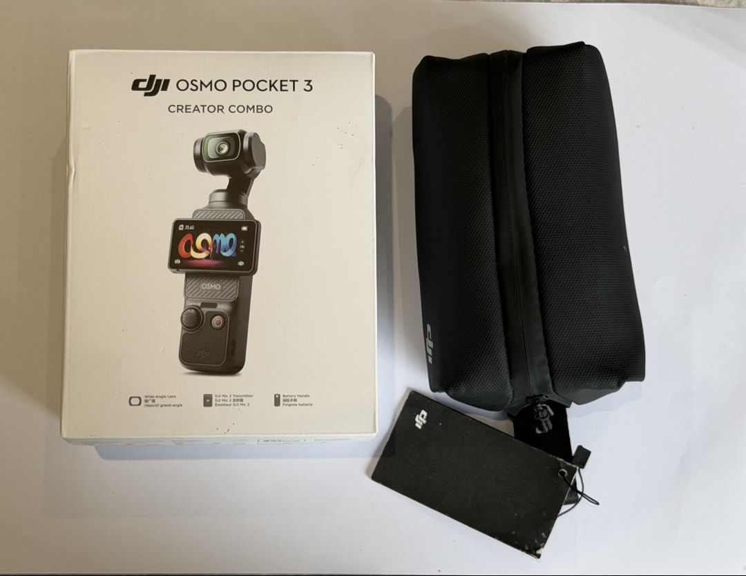DJI Osmo Pocket 3 Creator Combo (Category: Cameras) located in Balagtas. Submitted by kkramos08 (Listing ID 1460990861, Image 3). Description: - DJI Osmo Pocket 3 Creator Combo - Includes camera, protective case, mini tripod, charging cable, and microphone - Comes with wide-angle lens attachment - Charging handle included - All accessories pictured are included - Original box present RFS: decluttering Can do meetups in Balagtas, Bulacan or Makati