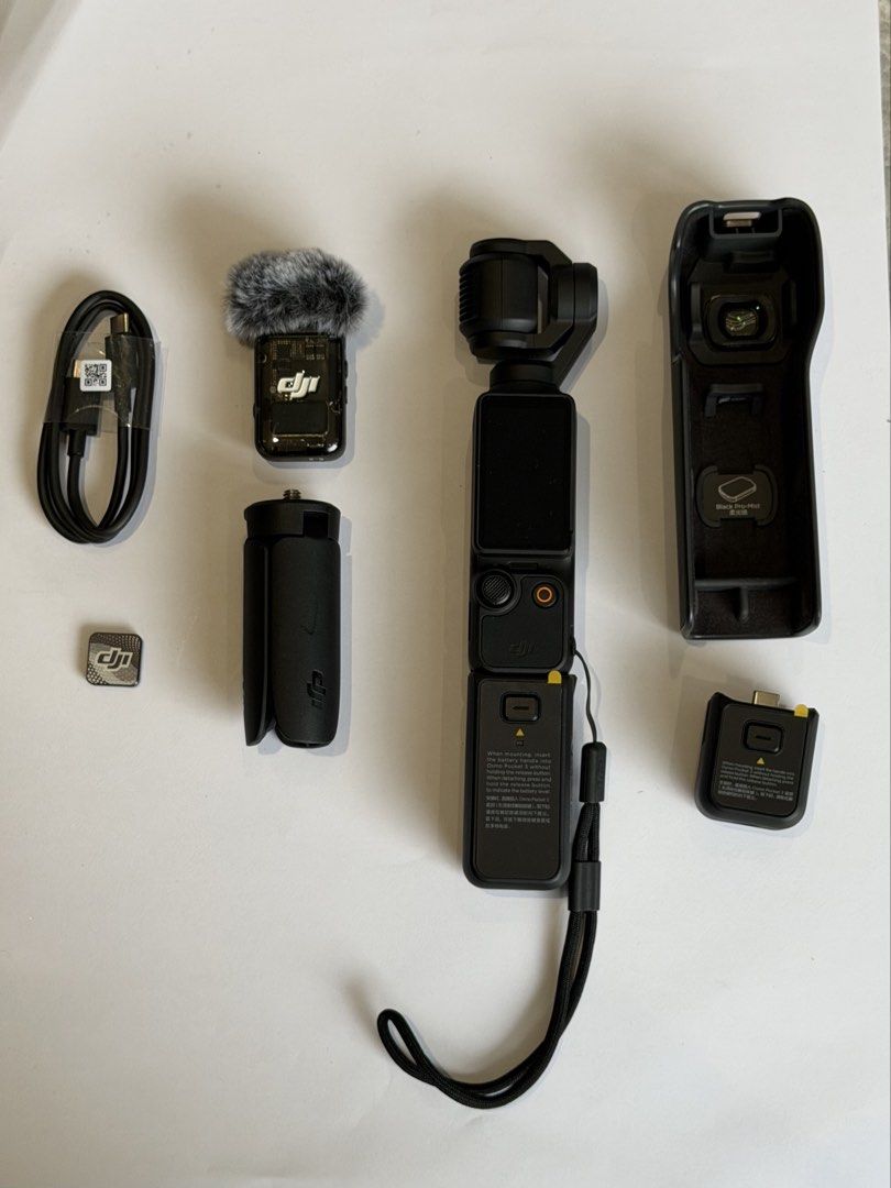 DJI Osmo Pocket 3 Creator Combo (Category: Cameras) located in Balagtas. Submitted by kkramos08 (Listing ID 1460990861, Image 2). Description: - DJI Osmo Pocket 3 Creator Combo - Includes camera, protective case, mini tripod, charging cable, and microphone - Comes with wide-angle lens attachment - Charging handle included - All accessories pictured are included - Original box present RFS: decluttering Can do meetups in Balagtas, Bulacan or Makati