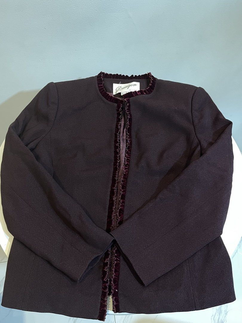 Dragon Collection Women's Jacket (Category: Coats, Jackets and Outerwear) located in Manila. Submitted by xoshushi.dcltr (Listing ID 1460972909, Image 1). Description: - Dark plum jacket from the Dragon Collection. - Features elegant velvet trim with intricate beaded details along the opening and neckline. - Classic round neckline with no buttons for a sleek look. - Highly versatile, perfect for dressing up or down..