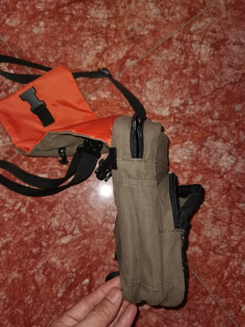 Ecko Unltd. Khaki Canvas Crossbody Bag (Category: Sling Bags) located in Caloocan City. Submitted by cooldudeszion (Listing ID 1460960972, Image 3). Description: - Brand: Ecko Unltd. - Color: Khaki - Style: Crossbody bag - Material: Canvas - Features: Multiple compartments and pockets for organization, adjustable strap, front flap with buckle closure, small zippered pocket on the front. - Condition: Shows some signs of wear but still functional. 