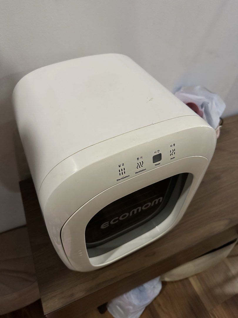 Ecomom Sterilizer Dryer (Category: Breastfeeding & Bottle Feeding) located in Quezon City. Submitted by jptee18 (Listing ID 1461000058, Image 3). Description: - Ecomom Sterilizer and Dryer - Multiple Modes: Sterilization, Ventilation, Auto - Ideal for Baby Bottles and Other Items - Durable Stainless Steel Interior - User-Friendly Controls on Top - Clean and Well-Maintained - Excellent Working Condition.