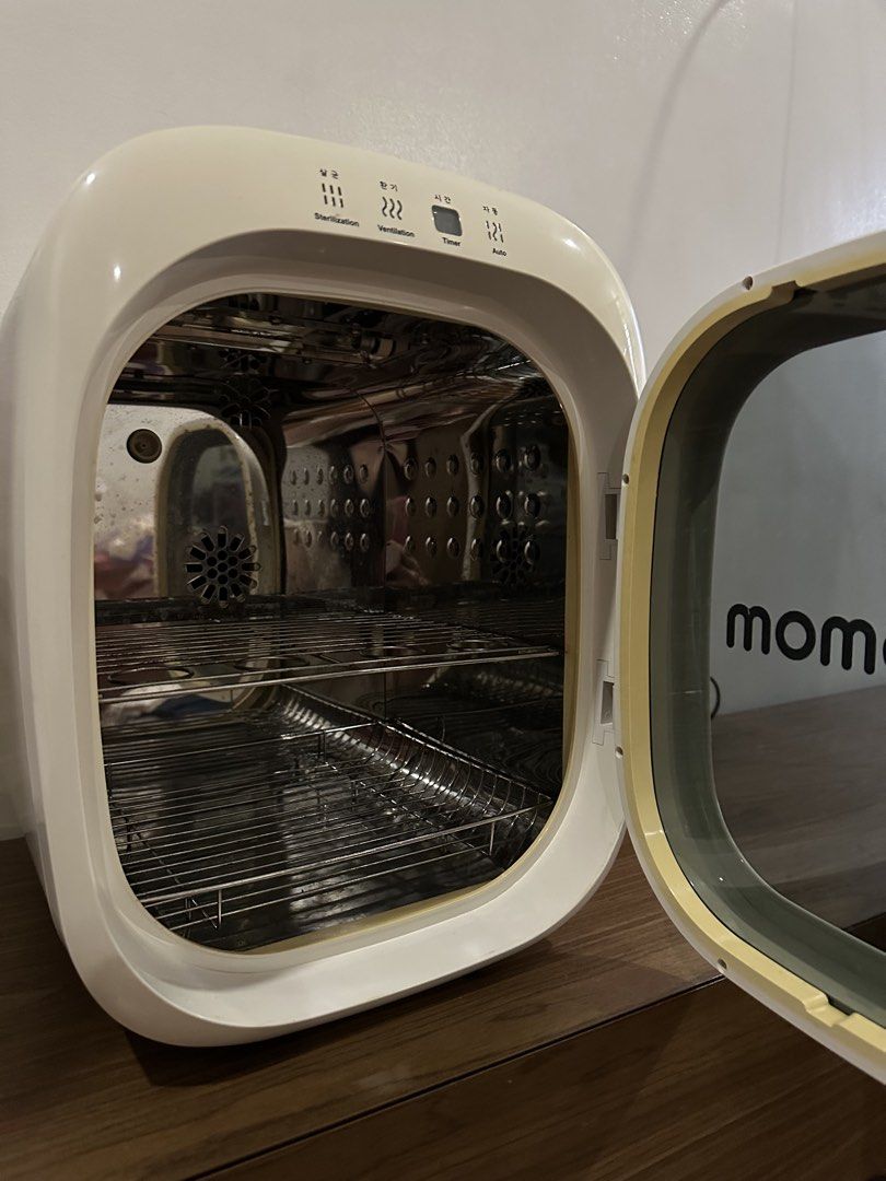 Ecomom Sterilizer Dryer (Category: Breastfeeding & Bottle Feeding) located in Quezon City. Submitted by jptee18 (Listing ID 1461000058, Image 2). Description: - Ecomom Sterilizer and Dryer - Multiple Modes: Sterilization, Ventilation, Auto - Ideal for Baby Bottles and Other Items - Durable Stainless Steel Interior - User-Friendly Controls on Top - Clean and Well-Maintained - Excellent Working Condition.