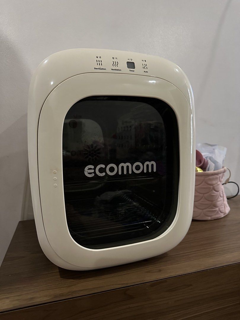 Ecomom Sterilizer Dryer (Category: Breastfeeding & Bottle Feeding) located in Quezon City. Submitted by jptee18 (Listing ID 1461000058, Image 1). Description: - Ecomom Sterilizer and Dryer - Multiple Modes: Sterilization, Ventilation, Auto - Ideal for Baby Bottles and Other Items - Durable Stainless Steel Interior - User-Friendly Controls on Top - Clean and Well-Maintained - Excellent Working Condition.