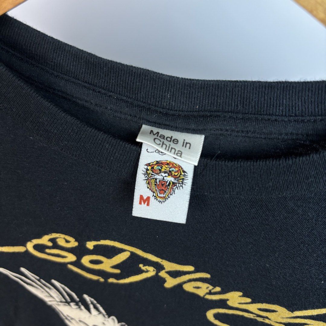Ed Hardy Eagle & Flag Graphic T-Shirt Size M (Category: Shirts) located in Santa Maria. Submitted by dazzle_thrifts (Listing ID 1461015981, Image 3). Description: Excellent condition Flaws: none Size: S-M Width: 16 Length: 20 .