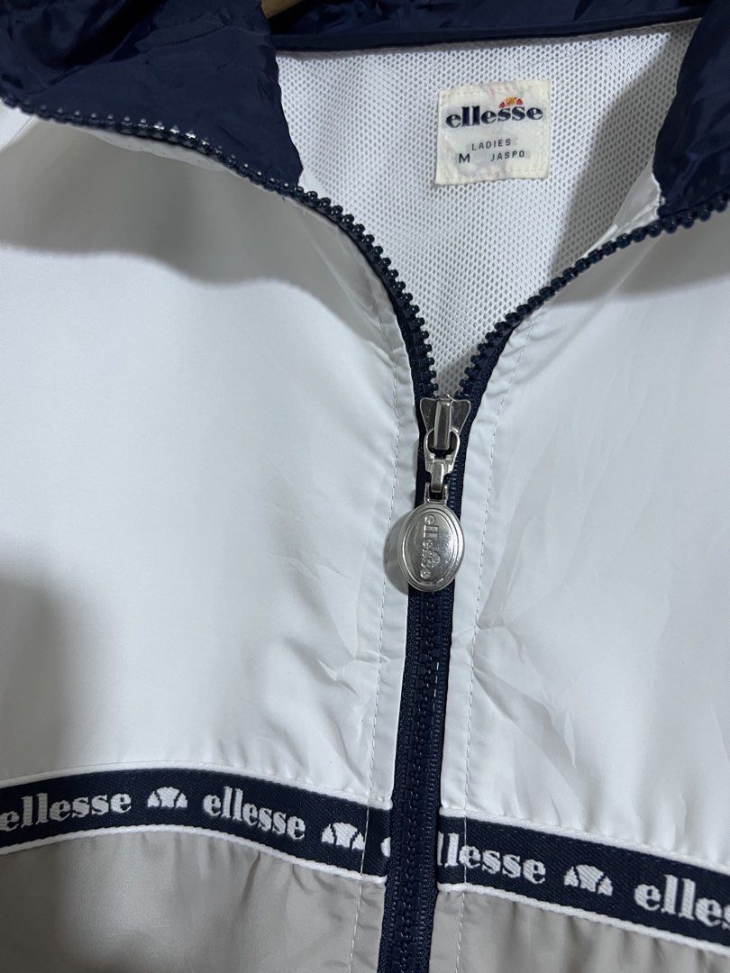 Ellesse White Tape Design Windbreaker (Category: Coats, Jackets and Outerwear) located in Manila. Submitted by thriftpoint99 (Listing ID 1461075402, Image 3). Description: 22.5x26.5 No issue Need wash only Excellent condition.