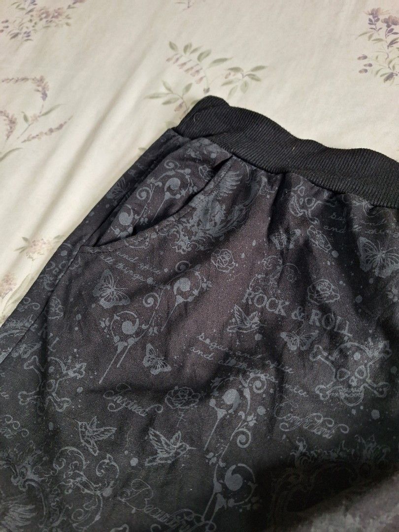 Emo alt punk graphic pull-on skirt // plus size (Category: Other Bottoms) located in Taguig. Submitted by butterflypea.thrift (Listing ID 1460975119, Image 3). Description: - size: xxl on tag, waist - 30, length - 14 - Stylish black pants with a unique dark grey all-over pattern. - Pattern features butterflies, roses, and ornate designs. - Comfortable elastic waistband. - Includes convenient pockets. - Ideal for casual wear..