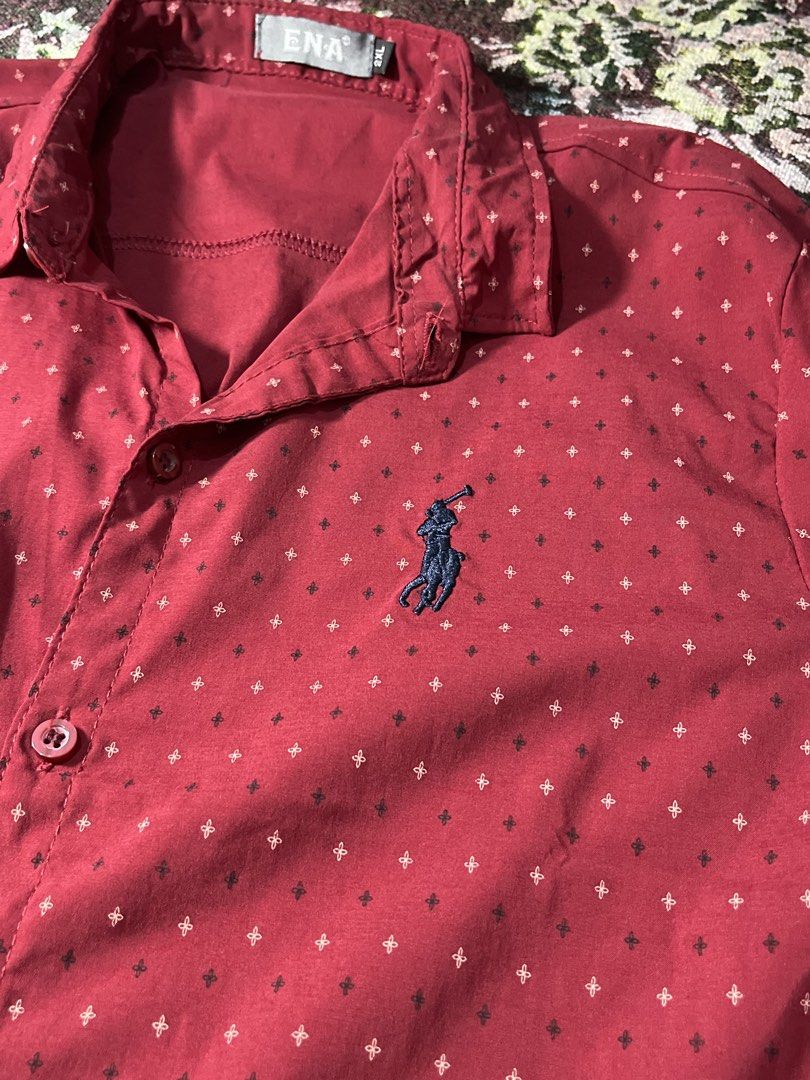 ENA Red Polo Shirt with Small Pattern - Size XL (Category: Tshirts & Polo Shirts ) located in Manila. Submitted by sennisen (Listing ID 1461094569, Image 2). Description: - Red short-sleeved polo shirt from ENA - Features a subtle, repeating small pattern all over - Classic polo collar and button-up front - Embroidered ENA logo on the chest - Size XL - Perfect for casual outings.
