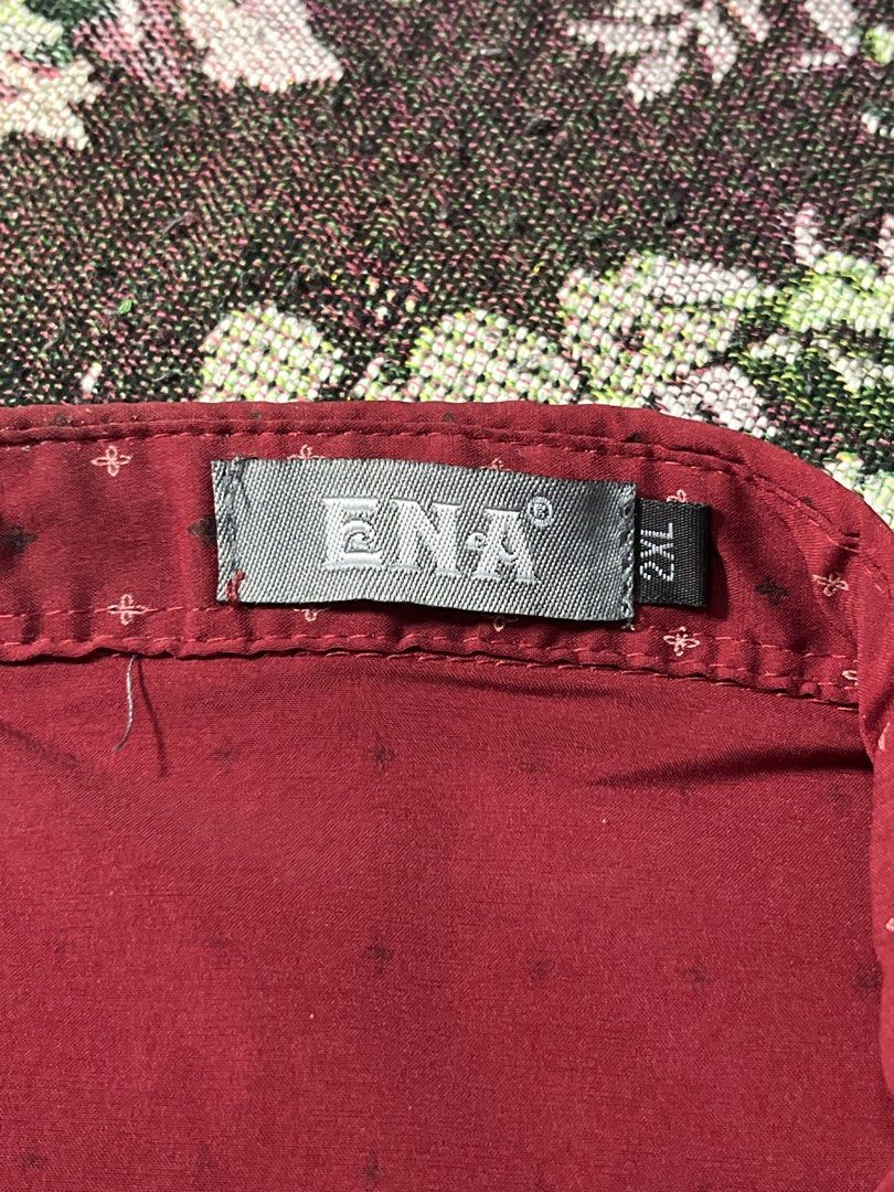 ENA Red Polo Shirt with Small Pattern - Size XL (Category: Tshirts & Polo Shirts ) located in Manila. Submitted by sennisen (Listing ID 1461094569, Image 3). Description: - Red short-sleeved polo shirt from ENA - Features a subtle, repeating small pattern all over - Classic polo collar and button-up front - Embroidered ENA logo on the chest - Size XL - Perfect for casual outings.