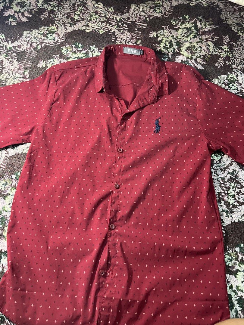 ENA Red Polo Shirt with Small Pattern - Size XL (Category: Tshirts & Polo Shirts ) located in Manila. Submitted by sennisen (Listing ID 1461094569, Image 1). Description: - Red short-sleeved polo shirt from ENA - Features a subtle, repeating small pattern all over - Classic polo collar and button-up front - Embroidered ENA logo on the chest - Size XL - Perfect for casual outings.