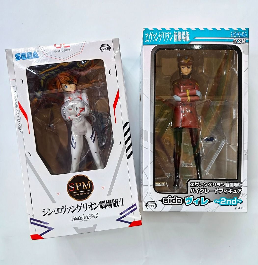 Evangelion action figures (Category: Figurines & Statues) located in Davao. Submitted by dukedelrey_01 (Listing ID 1461115333, Image 1). Description: SEGA Super Premium (SPM) (Asuka Shikinami Langley in her white plugsuit from) about 8.26 inches tall SEGA High Grade Figure (Misato Katsuragi in her red WILLE commander uniform and cap) about 6.7 inches tall Mint in sealed box.