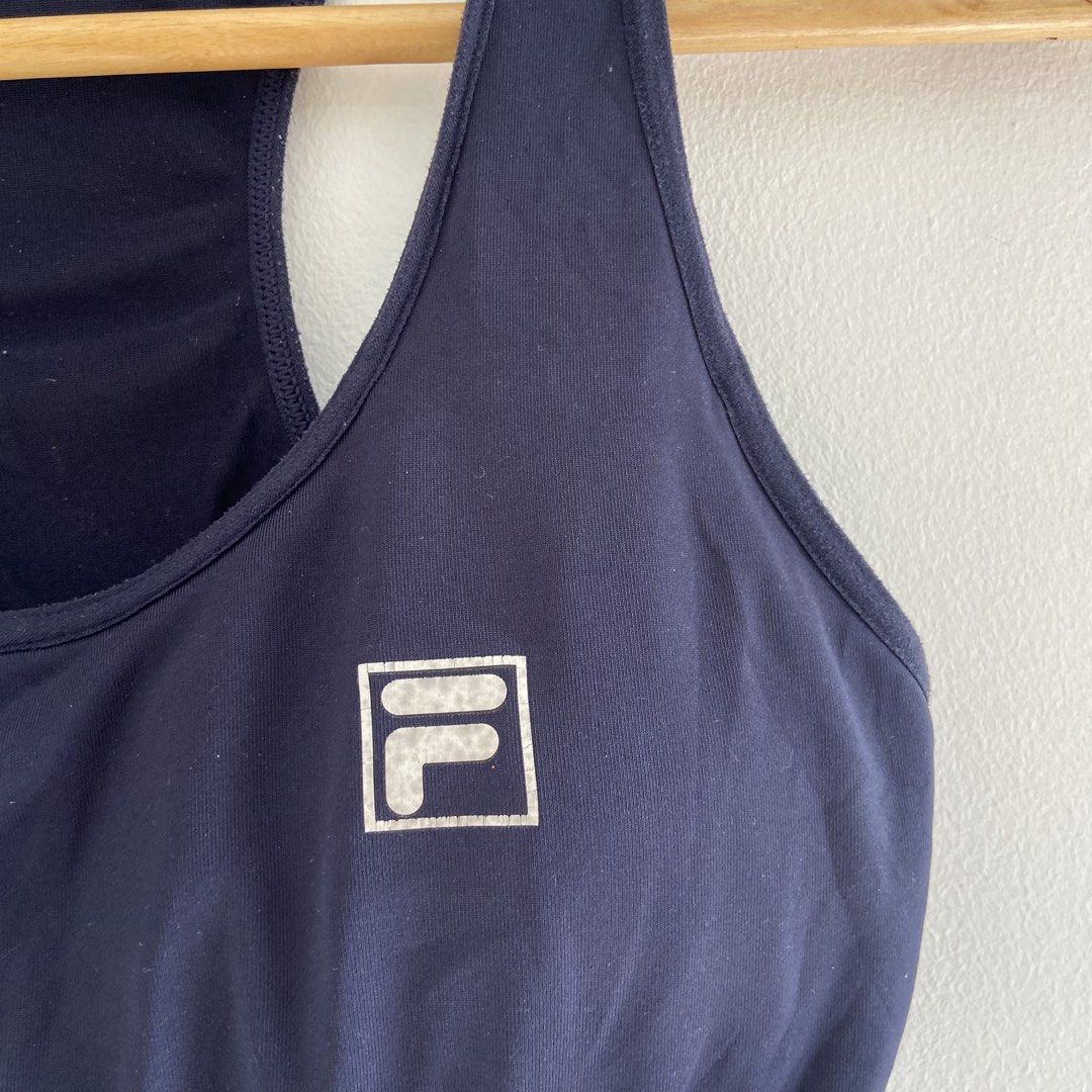 Fila Sports Bra (Category: Activewear) located in Angeles City. Submitted by eriellynnthrifts (Listing ID 1460948279, Image 2). Description: This is a navy blue FILA sports bra featuring a colorful striped elastic underband..