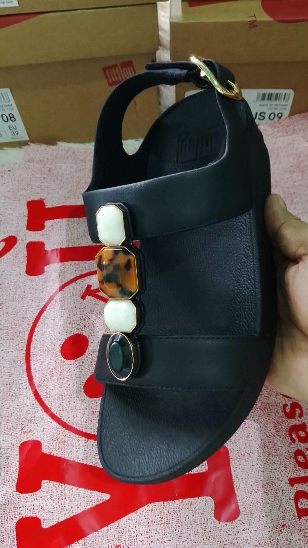 Fitflop Black Multi-Stone Strap Sandals (Category: Flats & Sandals) located in Las Pinas. Submitted by dalogdogjh77505 (Listing ID 1460939558, Image 3). Description: - Black Fitflop sandals - Decorated with white, tortoise shell, and dark green stones - Adjustable ankle strap with gold buckle onhand & Ready to shipped uS5 and us6 avail - Comfortable and stylish for everyday wear - Great for walking.