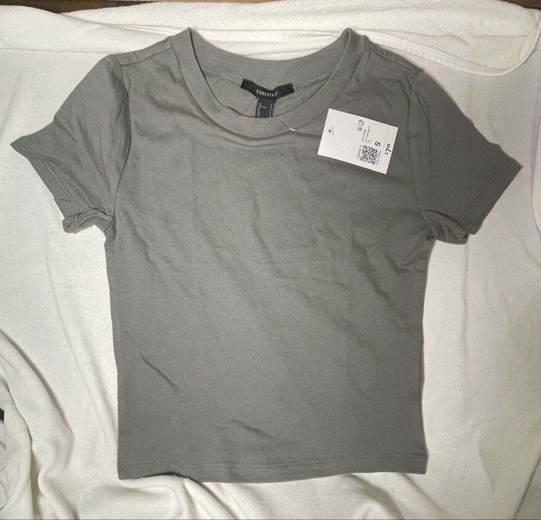 Forever 21 Basic Crew Neck T-Shirts (Size S) - Set of 3 (Category: Shirts) located in Mandaluyong City. Submitted by coolmeybab (Listing ID 1461006657, Image 3). Description: - Set of 3 Forever 21 crew neck t-shirts - Size: Small (S) - Colors: Mauve, Olive Green, Rust - Material: Soft and stretchy fabric - Condition: Brand new with original tags attached - Perfect for: Everyday wear, casual outfits, layering.