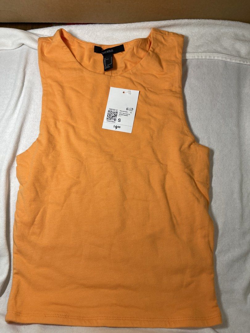 Forever 21 cotton Knit Tank Top Size S (Category: Sleeveless) located in Mandaluyong City. Submitted by coolmeybab (Listing ID 1461006747, Image 1). Description: - Brand: Forever 21 - Color: Orange - Type: Knit Tank Top - Size: S - Condition: Brand new with tag attached - Style: Casual, great for layering or wearing alone.
