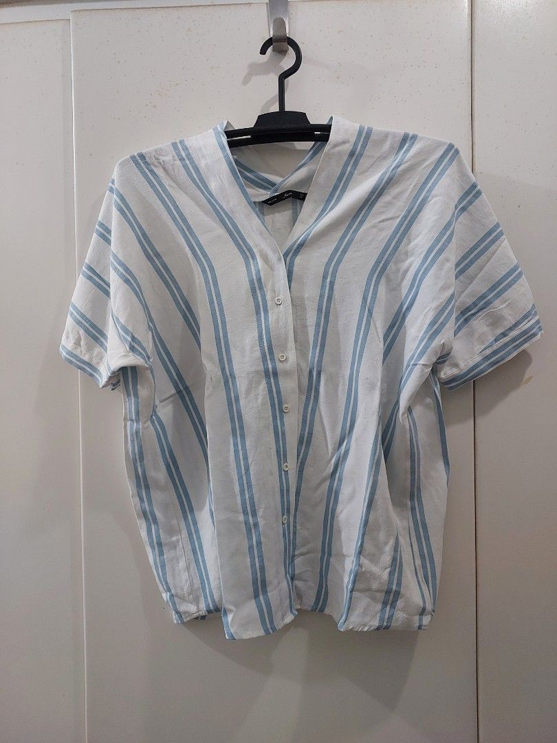 Forme Striped Button-Up Shirt (Category: Shirts) located in Makati City. Submitted by yishanjade (Listing ID 1460991444, Image 1). Description: - White and blue striped shirt - Brand: Forme - Style: Button-up, short sleeves - Size: M - Perfect for casual wear or layering.