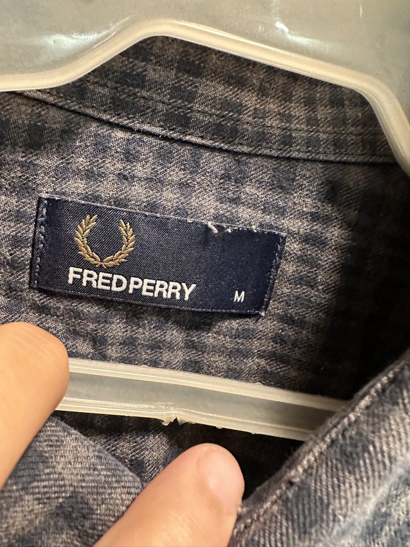 Fred Perry Checked Long Sleeve Shirt Size M (Category: Tshirts & Polo Shirts ) located in Bulacan. Submitted by adoseofluxxee (Listing ID 1461098530, Image 2). Description: - Fred Perry Long Sleeve Shirt - Size: M - Color: Grey and Navy subtle check pattern - Features embroidered Fred Perry laurel wreath logo on chest - Button-down collar.