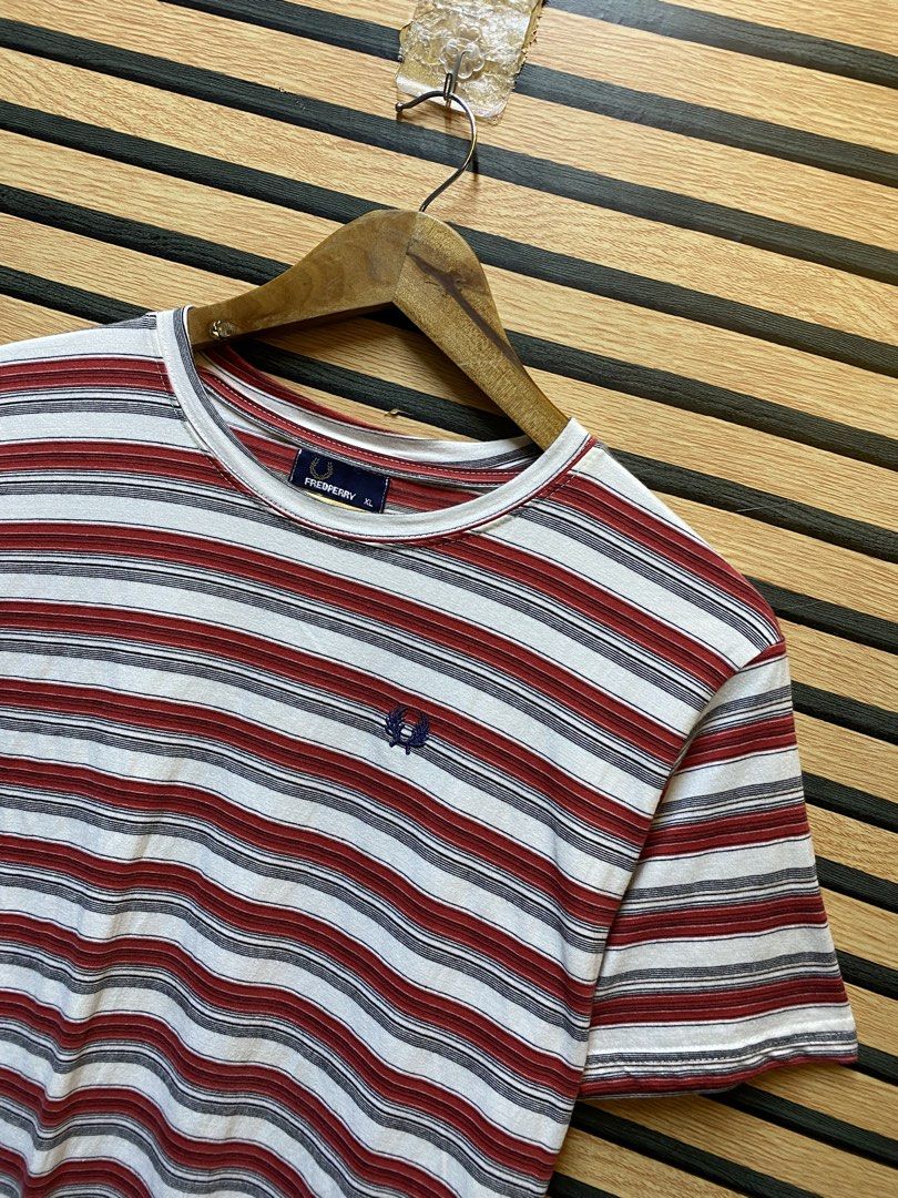 FREDPERRY “STRIPE TEE” (Category: Tshirts & Polo Shirts ) located in Makati City. Submitted by drip.poww (Listing ID 1461089244, Image 2). Description: - Authentic Fredperry - Color: White & red - Size: Meduim - Dimes: 20.5x30 - Authentic - Excellent condition - Need wash, fresh from bale - Material: 100% Cotton Please don’t expect too much—these are thrifted (ukay) items. 😊 !!STILL NEGOTIABLE!!.