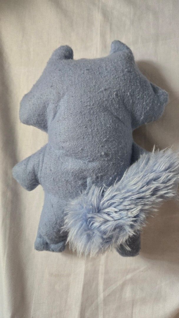 FUGGLER - Periwinkle Sketchy Squirrel (Category: Plushies & Soft Toys) located in Manila. Submitted by fierceriver.e57033 (Listing ID 1460953696, Image 2). Description: - No box, cut tag - Adorable handmade blue plush monster - Features big, expressive eyes and a wide mouth with visible teeth - Contrasting tan felt belly - Includes a fluffy blue tail - Soft, huggable, and perfect for collectors.