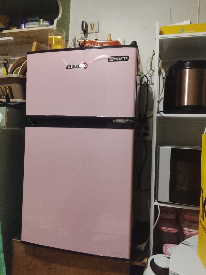 Fujidenzo Mini Refrigerator Inverter (Category: Refrigerators and Freezers) located in Manila. Submitted by kinanaaa (Listing ID 1461037524, Image 2). Description: - Compact Fujidenzo mini fridge - Two-door design with separate freezer compartment - Ideal for dorm rooms, offices, and small spaces - Keeps drinks and snacks perfectly chilled - Stylish dark grey color - In excellent working condition.
