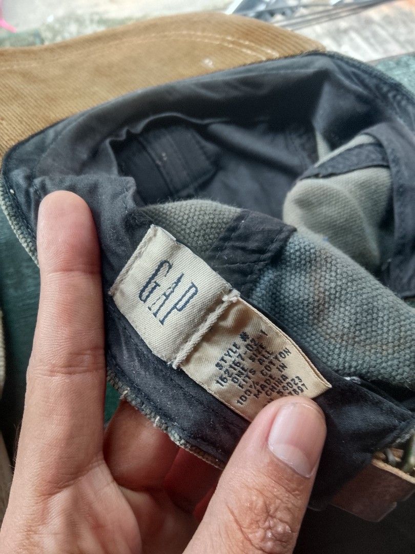 GAP American Traveler Cap (Category: Caps & Hats) located in Quezon City. Submitted by theoneshop1 (Listing ID 1460953423, Image 2). Description: - Classic GAP cap - Tan and brown colorway - Features a leather patch detail on the front - Made of 100% cotton - One size fits all - Ideal for everyday wear.