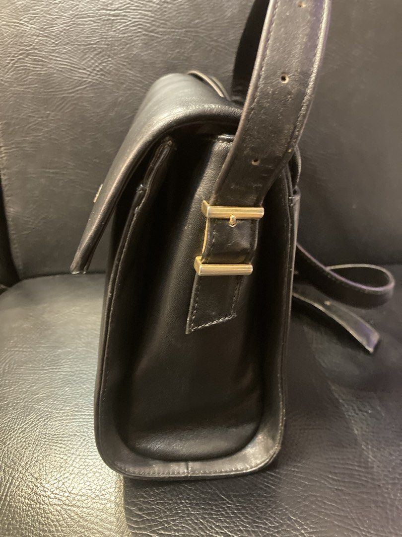 Givenchy Black Leather Shoulder Bag with Gold Clasp (Category: Luxury Bags & Wallets) located in Quezon City. Submitted by janisu0303 (Listing ID 1461050221, Image 3). Description: GIVENCHY Vintage Shoulder Bag. 8500 php Authentic Fairview area meetups Or shipping This chic handbag is crafted from black leather with a snakeskin-effect texture, including a length-adjustable matching strap. It features a gold-tone steel magnetic closure and four in