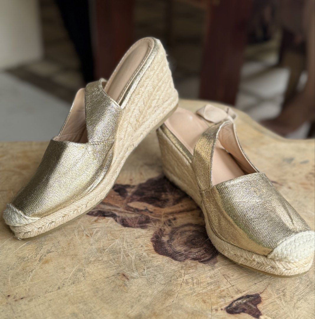 Gold Metallic Espadrille Wedge Slingback Heels (Category: Wedges) located in Bacolod City. Submitted by vintage_vogue6100 (Listing ID 1460980539, Image 2). Description: - Gold metallic espadrille wedge heels - Slingback style with tie-up ankle ribbons - Trendy square toe design - Comfortable wedge heel with natural jute detailing - Versatile: dress up or down - Ideal for summer occasions.