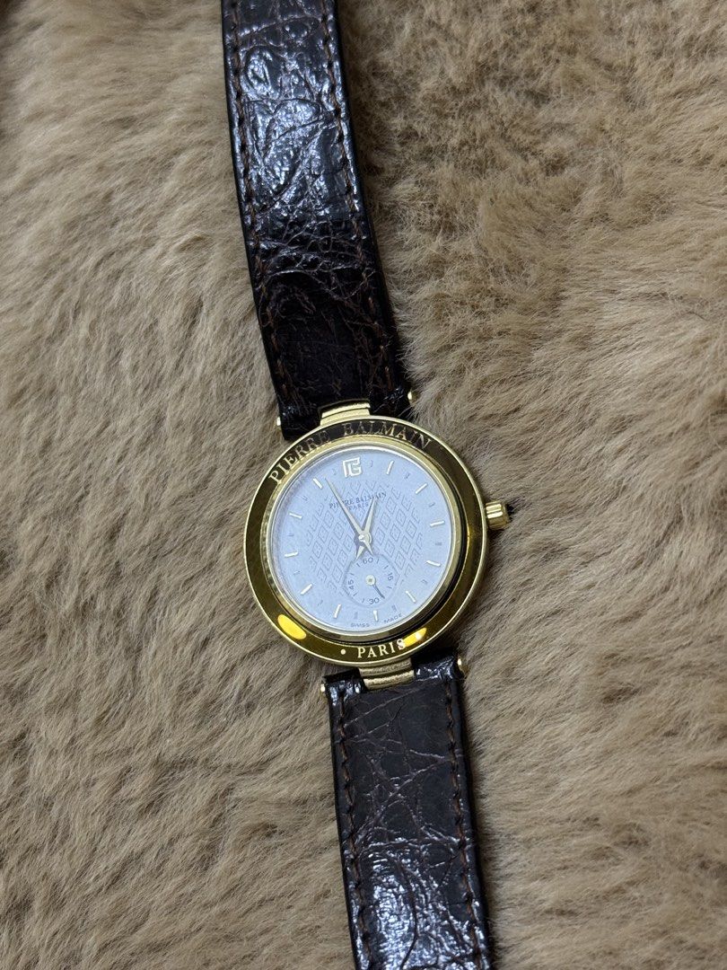 Gold Tone Watch (Category: Women's Watches) located in Bacolod City. Submitted by vintage_vogue6100 (Listing ID 1461043273, Image 2). Description: - Elegant gold tone casing - White patterned dial with a small seconds subdial at 6 o'clock - Comfortable dark brown leather strap - Water resistant 3 ATM - Stainless steel back - A timeless, classic timepiece.