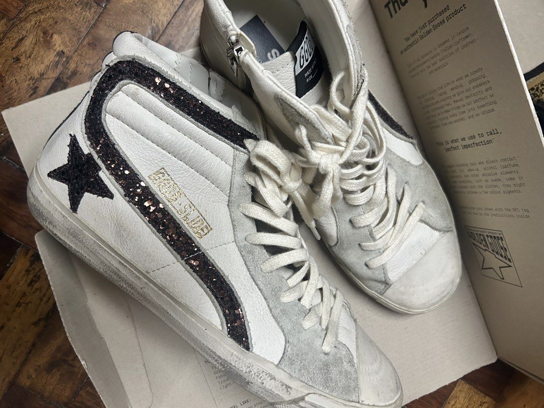 Golden Goose Slide Sneakers White Glitter Star (Category: Sneakers & Footwear) located in Quezon City. Submitted by apmso (Listing ID 1461069331, Image 3). Description: - Authentic Golden Goose white high-top sneakers - Signature star detail with glitter accents - Convenient side zip closure - Comes with original box - Includes original black laces - Made in Italy - Size 41 GUARANTEED AUTHENTIC RFS: downsizing shoe collection.