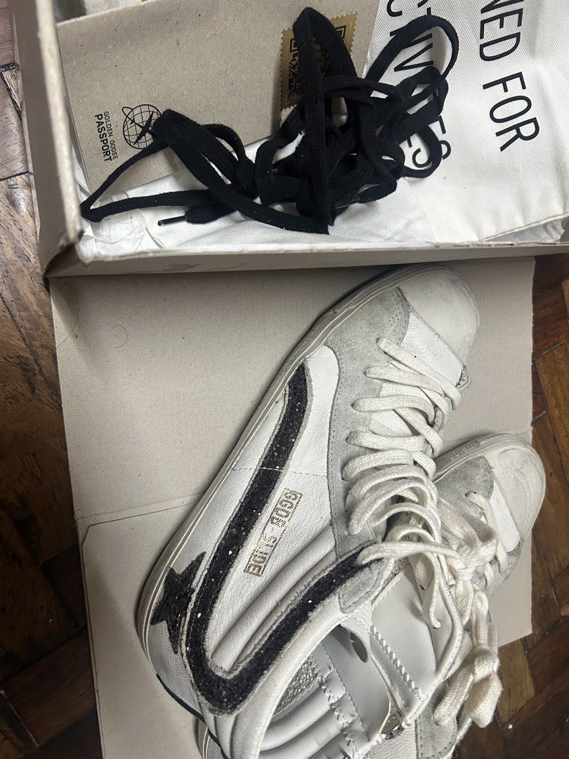 Golden Goose Slide Sneakers White Glitter Star (Category: Sneakers & Footwear) located in Quezon City. Submitted by apmso (Listing ID 1461069331, Image 1). Description: - Authentic Golden Goose white high-top sneakers - Signature star detail with glitter accents - Convenient side zip closure - Comes with original box - Includes original black laces - Made in Italy - Size 41 GUARANTEED AUTHENTIC RFS: downsizing shoe collection.