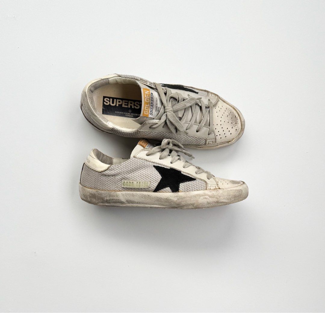 Golden Goose Superstar Sneakers (Category: Sneakers) located in Davao. Submitted by LUXURY (Listing ID 1461003579, Image 1). Description: Golden Goose Superstar sneakers with signature distressed look. Perfect for everyday wear. Size 36 Pair only Visit my profile for more luxury items.