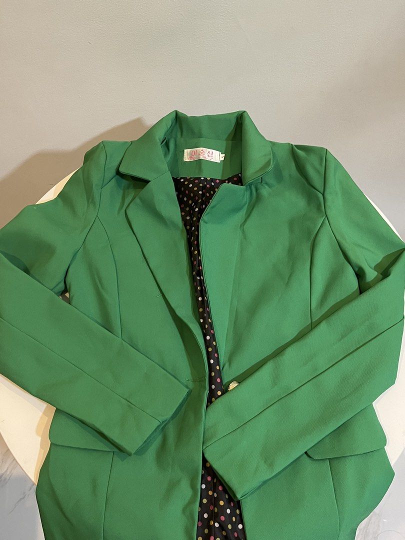Green Blazer with Polka Dot Lining (Category: Coats, Jackets and Outerwear) located in Manila. Submitted by xoshushi.dcltr (Listing ID 1460973447, Image 1). Description: - Eye-catching bright green blazer - Features a fun black lining with colorful polka dots - Single button closure for a sleek look - Versatile for dressing up any outfit - Ideal for both work and evening occasions.