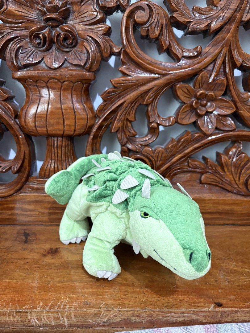 Green Dinosaur Plush Toy (Category: Plushies & Soft Toys) located in Quezon City. Submitted by rxyel (Listing ID 1461075857, Image 1). Description: - Adorable green dinosaur plush toy - Features spikes along its back and tail - Cute green eyes with black pupils - Super soft and cuddly material - Ideal gift for children or plush collectors.