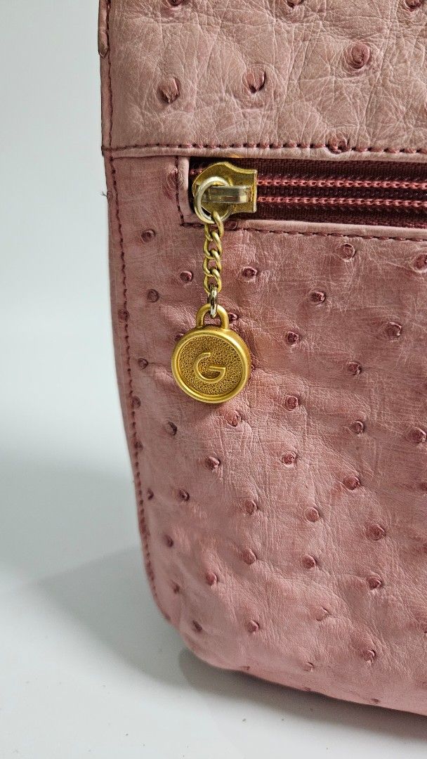 Gres genuine Pink Ostrich Leather Shoulder Bag (Category: Shoulder Bags) located in Alfonso. Submitted by jbcamet (Listing ID 1461033690, Image 2). Description: - genuine pink shoulder bag - Genuine ostrich leather with a unique textured finish - Convenient front zippered compartment - Elegant gold hardware and chain detail - Adjustable strap for comfortable wear - Ideal for everyday use and adding a pop of color to your outfit.