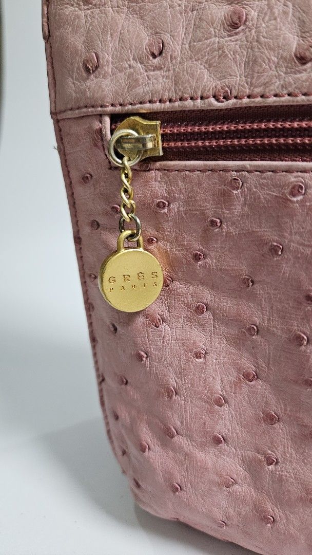 Gres genuine Pink Ostrich Leather Shoulder Bag (Category: Shoulder Bags) located in Alfonso. Submitted by jbcamet (Listing ID 1461033690, Image 3). Description: - genuine pink shoulder bag - Genuine ostrich leather with a unique textured finish - Convenient front zippered compartment - Elegant gold hardware and chain detail - Adjustable strap for comfortable wear - Ideal for everyday use and adding a pop of color to your outfit.