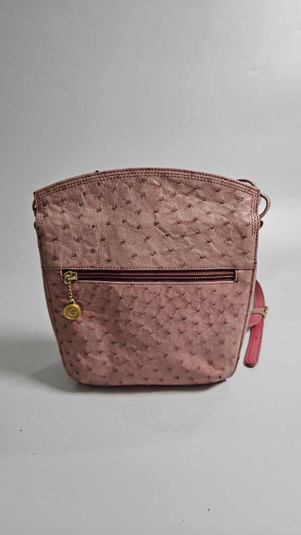 Gres genuine Pink Ostrich Leather Shoulder Bag (Category: Shoulder Bags) located in Alfonso. Submitted by jbcamet (Listing ID 1461033690, Image 1). Description: - genuine pink shoulder bag - Genuine ostrich leather with a unique textured finish - Convenient front zippered compartment - Elegant gold hardware and chain detail - Adjustable strap for comfortable wear - Ideal for everyday use and adding a pop of color to your outfit.