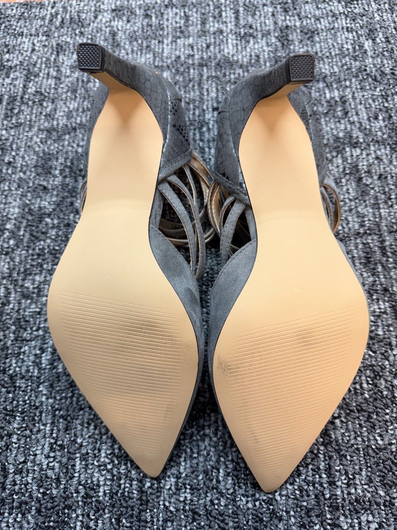 Grey Suede Strappy Pointed Toe Heels (Category: Heels) located in Makati City. Submitted by bagattic_etc (Listing ID 1460941547, Image 2). Description: Chic grey suede heels with strappy design, pointed toe, and stiletto heel. Back zipper closure. Minimal wear on sole. Size 8.