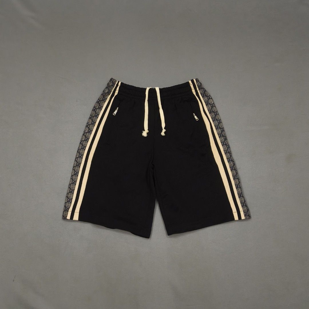 Gucci Black GG Monogram Track Shorts Size S (Category: Shorts) located in Cebu City. Submitted by greedthrift.00 (Listing ID 1461029261, Image 1). Description: - condition: 9.8/10 - color rate: 9.8/10 - Issue: none - waistline: 28" - 35" (adjustable) - length: 20" - leg opening: 12".