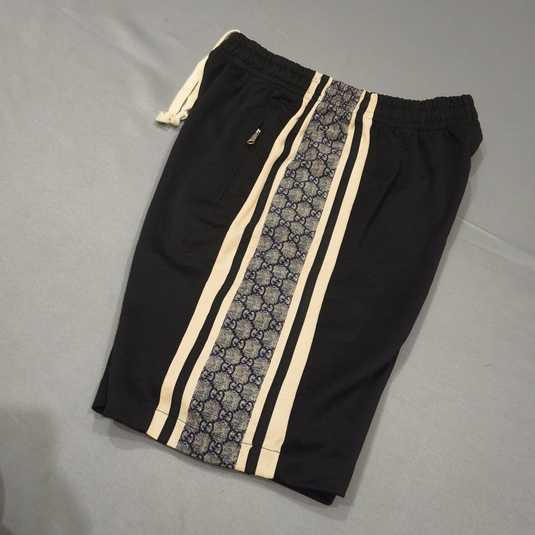 Gucci Black GG Monogram Track Shorts Size S (Category: Shorts) located in Cebu City. Submitted by greedthrift.00 (Listing ID 1461029261, Image 2). Description: - condition: 9.8/10 - color rate: 9.8/10 - Issue: none - waistline: 28" - 35" (adjustable) - length: 20" - leg opening: 12".