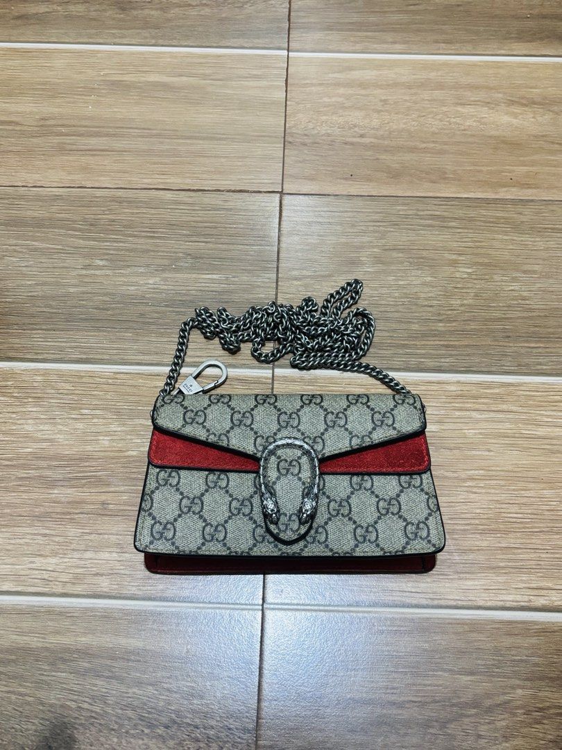 Gucci Dionysus GG Supreme Mini Bag (Category: Luxury Bags & Wallets) located in Aroroy. Submitted by paldogs (Listing ID 1461072224, Image 1). Description: - Authentic Gucci Dionysus mini bag - Signature GG Supreme canvas - Red suede detailing - Iconic tiger head closure - Versatile chain strap - Luxurious red leather interior.