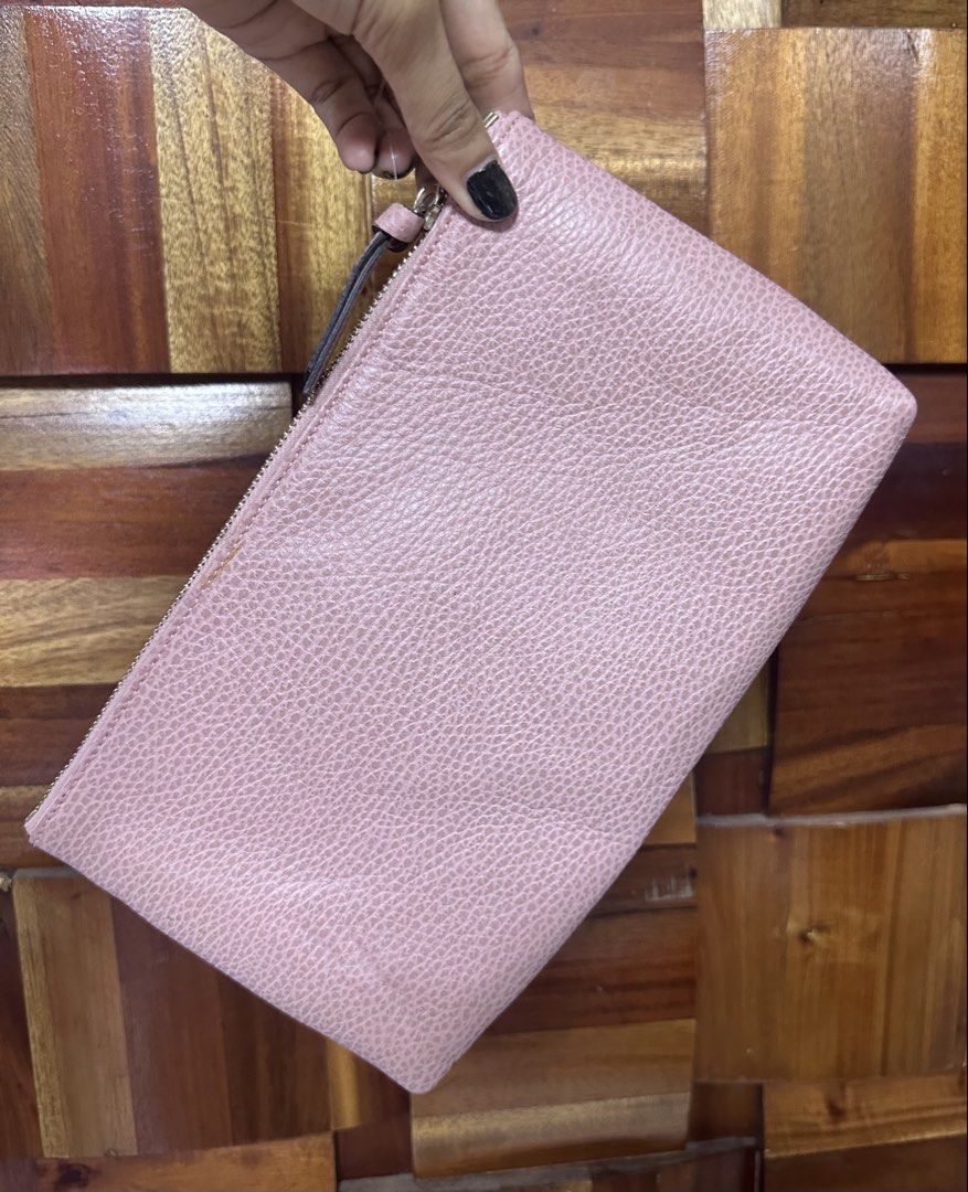 Gucci Pink Leather Pouch (Category: Luxury Bags & Wallets) located in General Trias. Submitted by mimispreloves (Listing ID 1461092457, Image 2). Description: - Authentic Gucci pouch - Lovely pink shade - Made in Italy - Textured leather exterior - Interior slip pocket - Zipper closure - Ideal for organizing essentials or as a clutch.