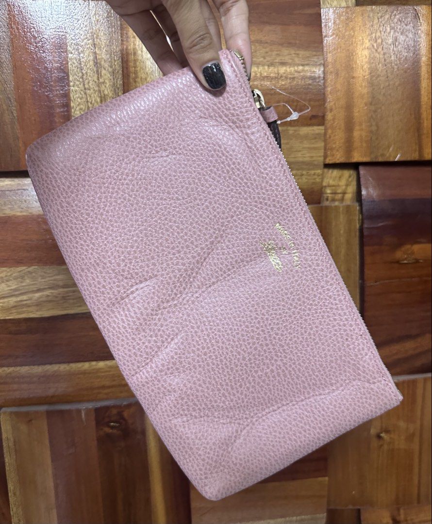 Gucci Pink Leather Pouch (Category: Luxury Bags & Wallets) located in General Trias. Submitted by mimispreloves (Listing ID 1461092457, Image 1). Description: - Authentic Gucci pouch - Lovely pink shade - Made in Italy - Textured leather exterior - Interior slip pocket - Zipper closure - Ideal for organizing essentials or as a clutch.