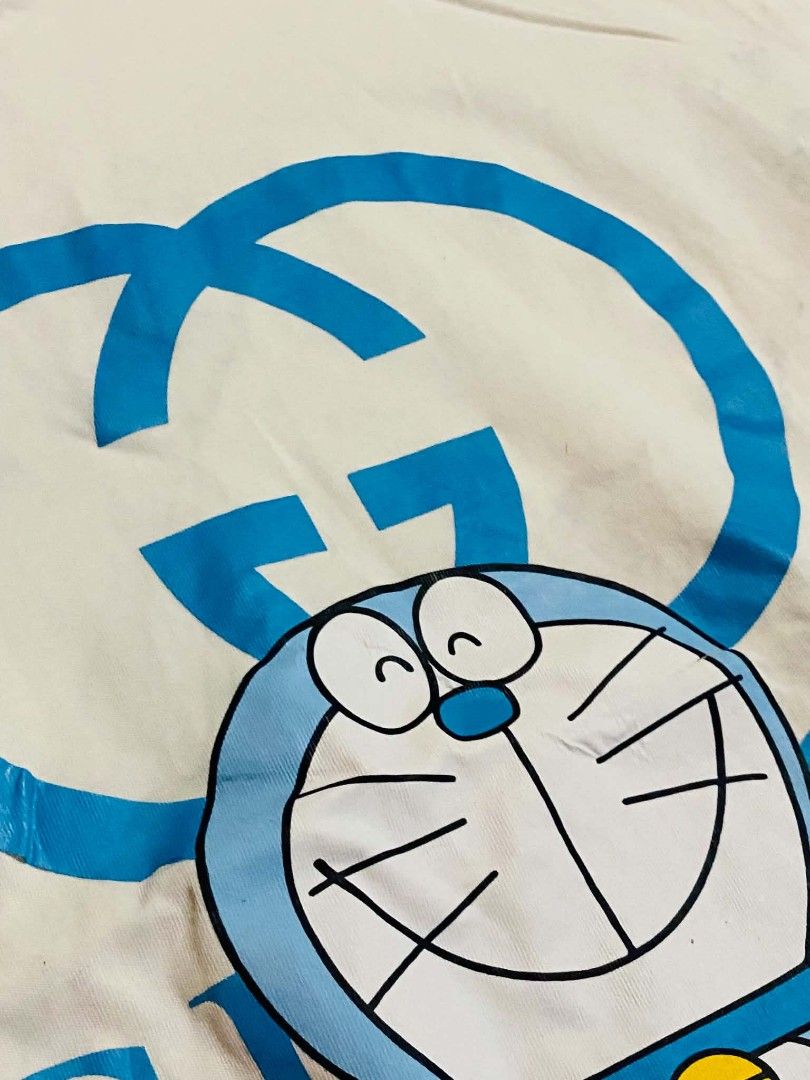 GUCCI x DORAEMON Oversized T-Shirt — White/Blue (Category: Shirts) located in San Isidro, Davao Oriental. Submitted by ranofrehets (Listing ID 1461101794, Image 2). Description: 🐱💙 GUCCI x DORAEMON Oversized T-Shirt — White/Blue 💙🐱 👕 Unisex 📏 Size: Medium–Large (Stretchable) ✨ Condition: Like New ✅ No Stain ✅ No Issue Cute, stylish, and easy to wear—perfect for both men & women! 🤍💙 💰 Price: ₱350 + SF 📩 PM to reserve! 📸 IG: @luxuryshunt